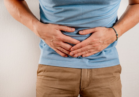 Person holding their stomach