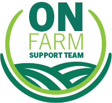 A logo with the words On Farm Support Team inside a light and dark green circle. Under the words are rounded green lines to represent hills.