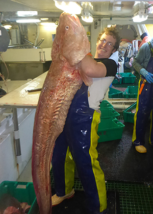 Stewart holding up a fish longer than he is