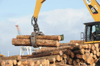 machine picking up logs