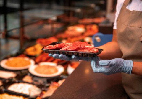 A selection of cut meats in a butcher's shop