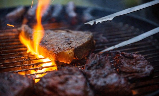 Meat grilling in flame barbecue. 